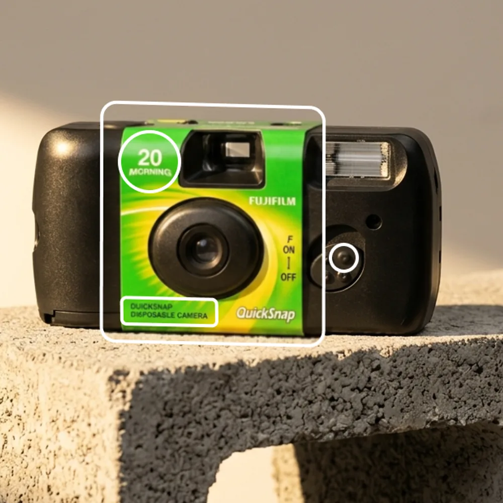 The same camera generated from a written description. A “20 MORNING” badge that does not exist has appeared, the flat green has become a yellow-green gradient, and the small print reads “DUICKSNAP DI6POSASLE CAMERA”.